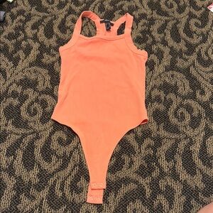 Never worn Orange Ribbed Bodysuit